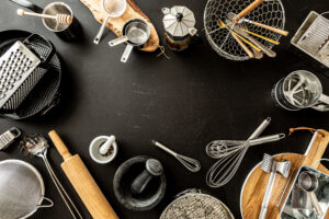 kitchen utensils on black background