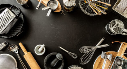 kitchen utensils on black background
