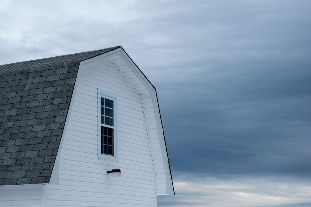 exterior of the loft area of a white barn