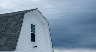 exterior of the loft area of a white barn