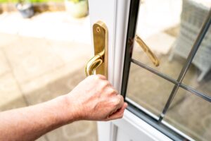 homeowner opening door to patio
