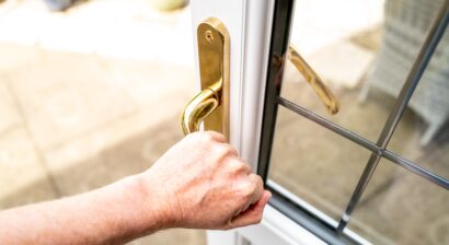 homeowner opening door to patio