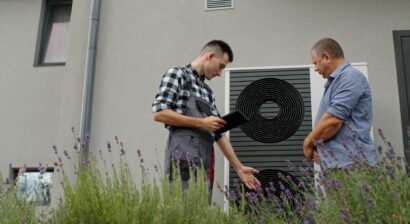 hvac technician consults with homeowner about unit
