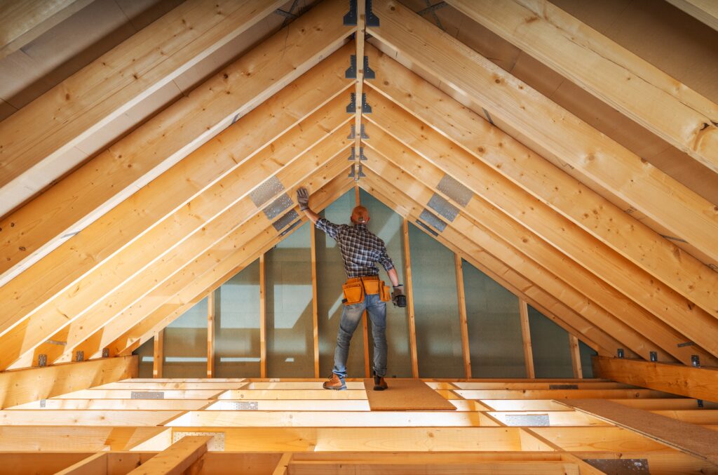 construction worker using measuring tape during renovation