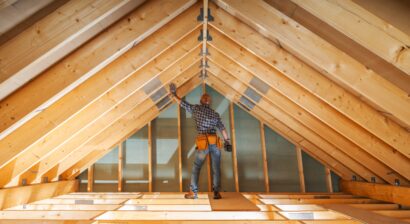 construction worker using measuring tape during renovation