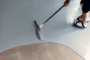 construction worker applying garage coat