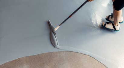 construction worker applying garage coat