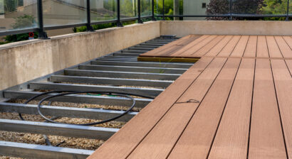 construction of a wooden terrace on a balcony