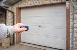 garage door and hand holding remote