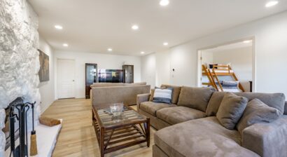 basement recreational room with large sectional sofa