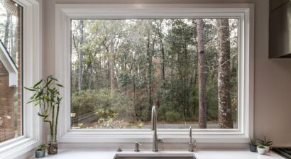 large farmhouse sink with big picture window in kitchen