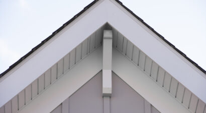 white brackets on a triangle gable roof