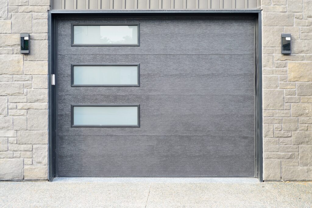 a large grey panel metal garage door