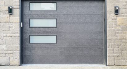 a large grey panel metal garage door