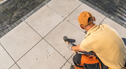 professional installing tile flooring