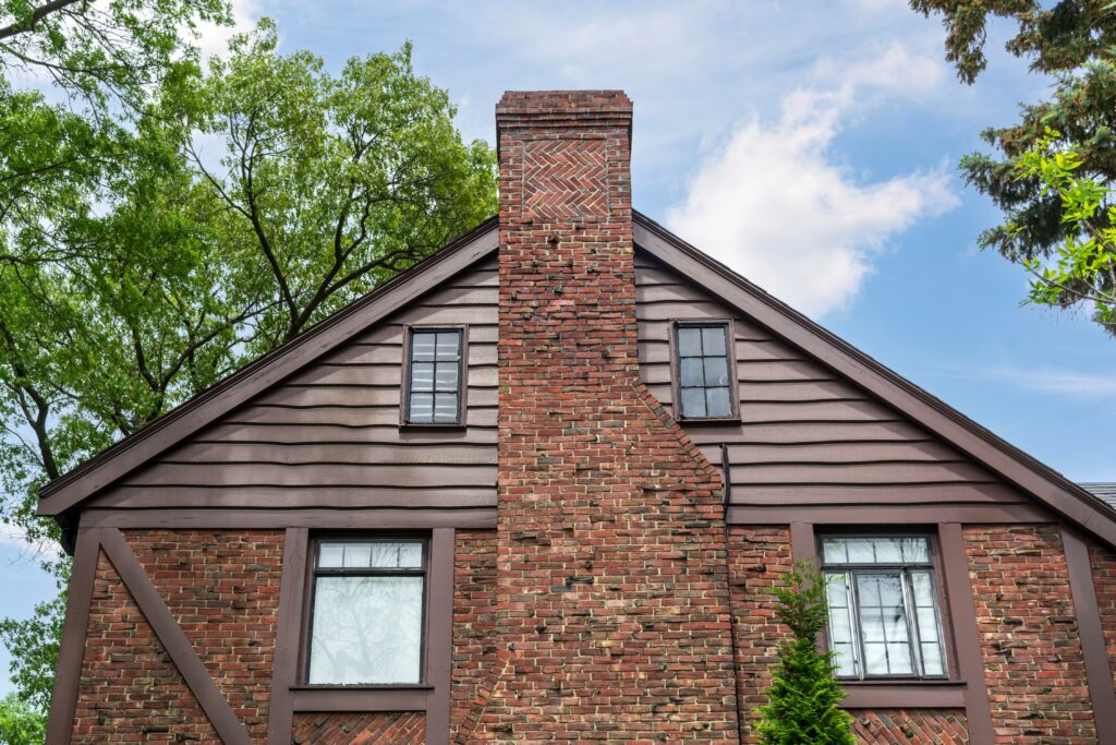 traditional house exterior with multiple types of siding