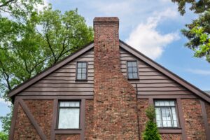 traditional house exterior with multiple types of siding