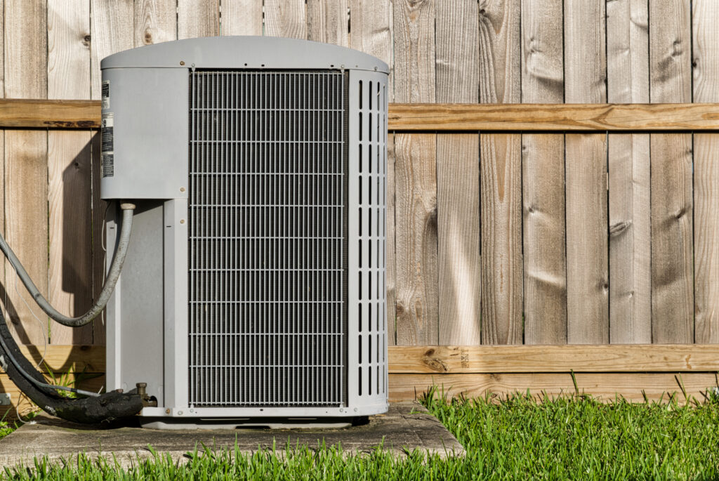central air conditioning unit in a residential backyard