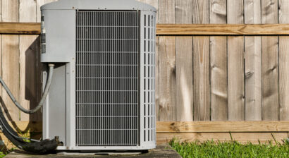 central air conditioning unit in a residential backyard