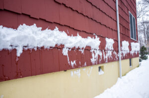 side of house covered in snow
