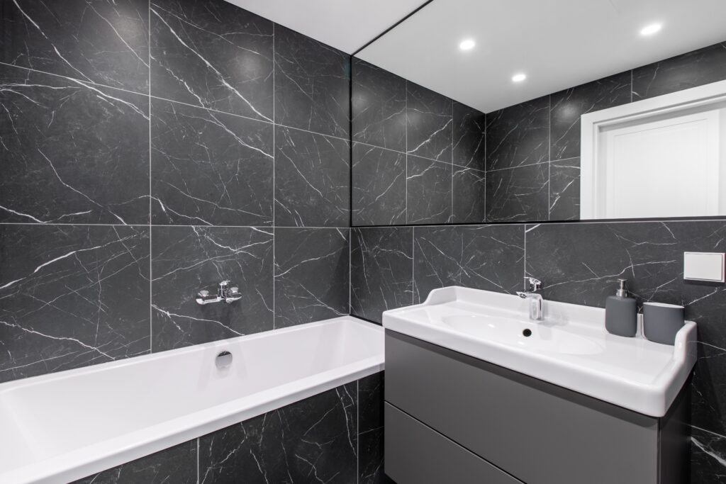 elegant bathroom interior with marbled tile walls