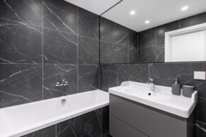 elegant bathroom interior with marbled tile walls