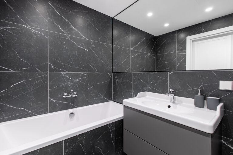 elegant bathroom interior with marbled tile walls