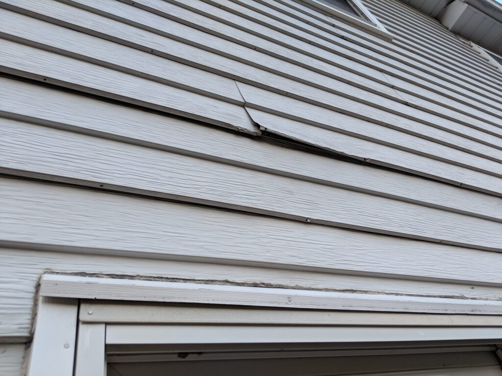 old white metal siding